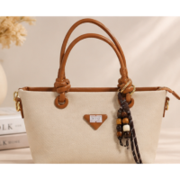Elegant knotted handle textured handbag in Beige - front view