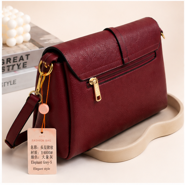 Elegant textured crossbody shoulder bag in Wine Red - angled view